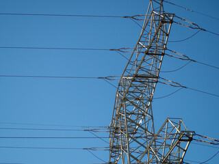 High voltage wires. Energy supply. Metal poles of electrical wires.