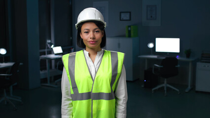 Portrait of African-American woman engineer in safety vest and helmet