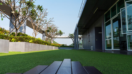 Sky garden on private rooftop of condominium or hotel rooftop, high architecture building with tree...