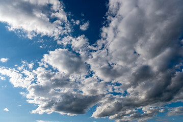 white fluffy clouds in the blue sky