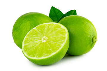 Lime citrus fruits in wholes and cut crosswise in half with leaves isolated on white background with clipping path, cutout.