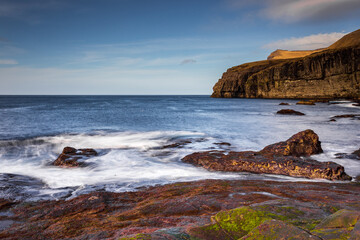 Steep coast of the islands of Eidi. Faroe Islands.