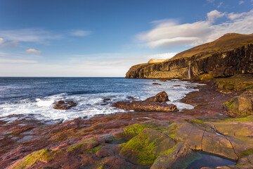 Steep coast of the islands of Eidi. Faroe Islands.