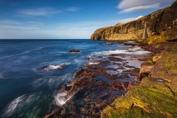 Steep coast of the islands of Eidi. Faroe Islands.