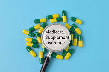 Pill capsule and stethoscope with text MEDICARE SUPPLEMENT INSURANCE