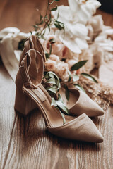 high heel wedding shoes near bridal bouqet