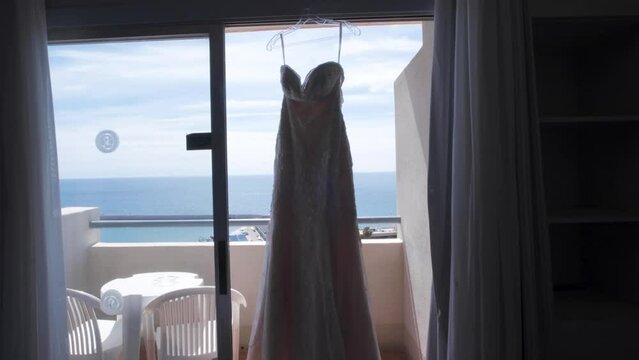 Wedding Dress Reveal, Showing The Wedding Dress Hanging in The Window