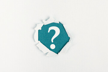 Question mark on paper background, search for answers, education concept, faq in business
