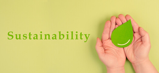 Holding a green drop, alternative bio fuel, recycling resourses, sustainability lifestyle, ecology concept