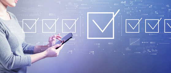 Checklist concept with business woman using a tablet computer