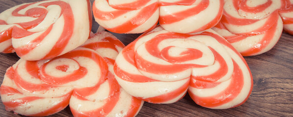 Sweet lollipop in shape of heart on board. Surprise for birthday, valentine or different occasions