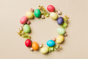 round frame Multi colors Easter eggs on colored background . Pastel color Easter eggs holiday concept with empty space for you design
