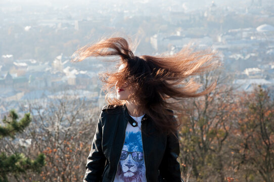 young sexy woman with long windy hair outdoor