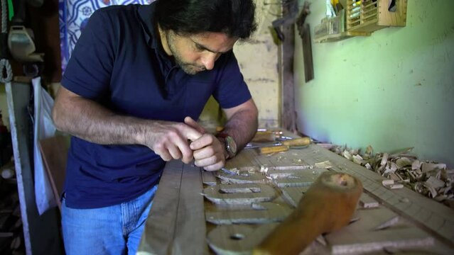Turkish Wood Carving Master makes wooden toys and souvenirs for her customers.
