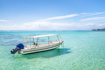 Obraz na płótnie Canvas Small boat at the lagoon, Bora Bora, French Polynesia