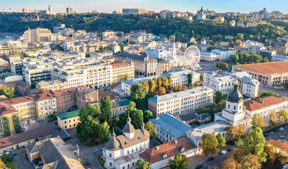 Fototapeta na wymiar Kyiv cityscape aerial drone view, Dnipro river, downtown and Podol historical district skyline from above, city of Kiev and Dnieper, Ukraine