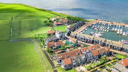 Aerial drone view of Marken island, traditional fisherman village from above, typical Dutch landscape, North Holland, Netherlands