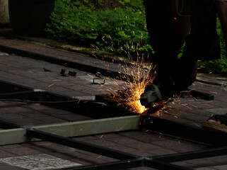 blacksmith working with ginding tool
