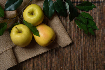Still life of apples on wicker tablecloth. 