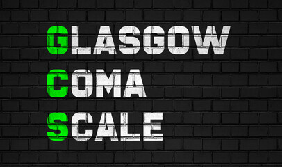 Fototapeta na wymiar Glasgow coma scale (GCS) concept,healthcare abbreviations on black wall