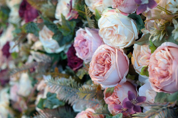 a wall decorated with pink roses