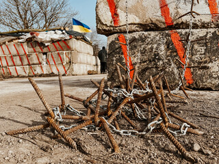 12.03.2022 Irpin, Ukraine: Homemade iron thorns to stop enemy cars, self-made checkpoint at the entrance to the village to check cars and detect saboteurs or stop enemy vehicles.