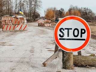 12.03.2022 Irpin, Ukraine: self-made checkpoint at the entrance to the village to check cars and...