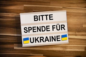 Lightbox or light box with the german words for please donate for ukraine - bitte spende für...