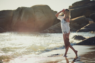 The best therapy is beach therapy. Shot of a beautiful young woman posing on the beach.