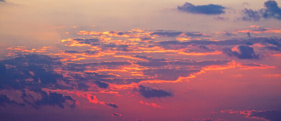Dramatic sky with cloud at sunset. Wide photo.