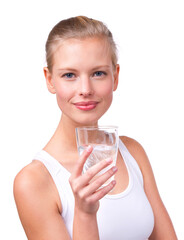 The healthy hydration option. Portrait of a beautiful young woman with a glass of water isolated on white.