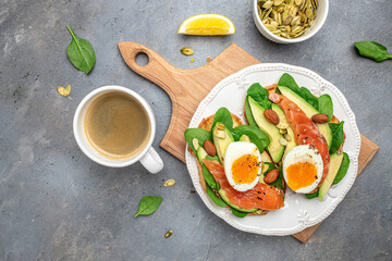 Toast salmon, avocado, cheese, egg, spinach, nuts and coffee, Healthy fats, clean eating for weight loss. Ketogenic diet breakfast. banner, menu, recipe place for text, top view