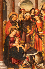 VALENCIA, SPAIN - FEBRUAR 14, 2022: The painting of Adoratino of Magi on the side altar  in the...