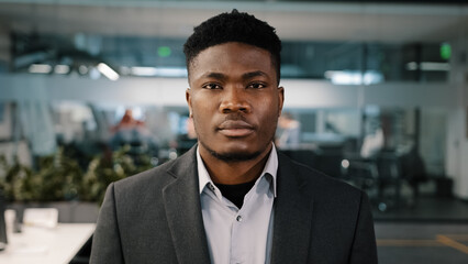 Close up portrait African american young businessman entrepreneur investor confident male face...