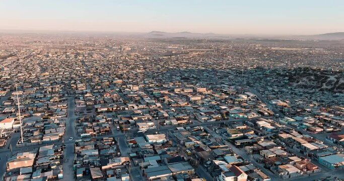 Poverty.Inequality.Aerial fly over view of the densely populated Khayelitsha township on the Cape Flats, Cape Town, South Africa