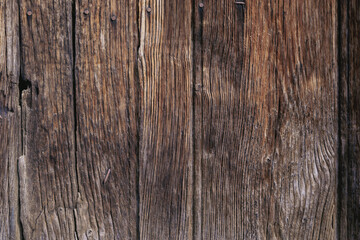Texture of aged wood planks with vertical lines.