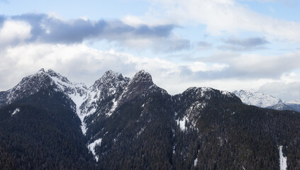 Aerial Panoramic View of Canadian Rocky Mountain Landscape. Cloudy Sky Art Render.. Located near Vancouver, British Columbia, Canada. Nature Background