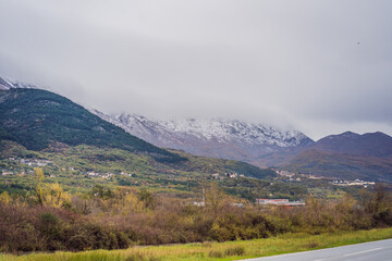 Mountains covered with snow and greenery all around