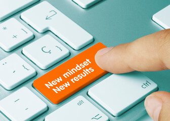 New mindset, New results - Inscription on Orange Keyboard Key.