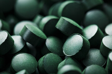 Close-up of Green tablets of organic spirulina