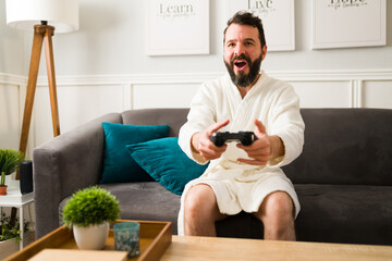 Excited man playing a fun video game