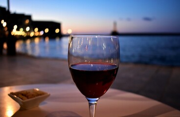 glass of wine at night in greece