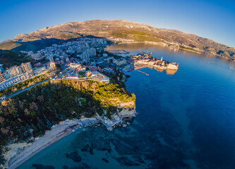 Fototapeta premium Landscape of Old town Budva: Ancient walls and red tiled roof. Montenegro, Europe. Budva - one of the best preserved medieval cities in the Mediterranean and most popular resorts of Adriatic Riviera