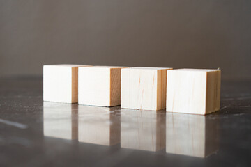 Obraz na płótnie Canvas Wooden cube four pieces stacked on the floor.