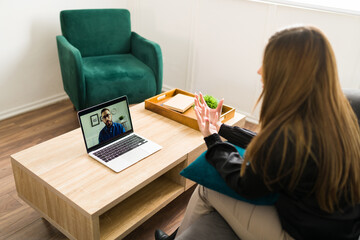 Stressed woman talking with a virtual therapist