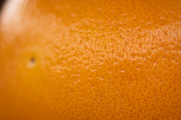 A beautiful macro photograph of the inside of a grapefruit with stunning textured effect showing the healthy juice that is good for lifestyle and heart and body and mind
