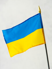 Ukrainian state flag on a white background. Symbol of patriotism, independence, freedom. Plans for...