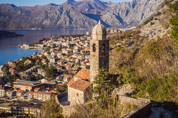 Fototapeta na wymiar Old city. Kotor. Montenegro. Narrow streets and old houses of Kotor at sunset. View of Kotor from the city wall. View from above