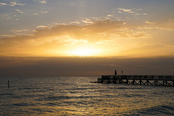 Beautiful sunrise over the ocean with a footbridge in Makadi Bay, Egypt