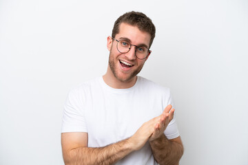 Young caucasian man isolated on white background With glasses and applauding